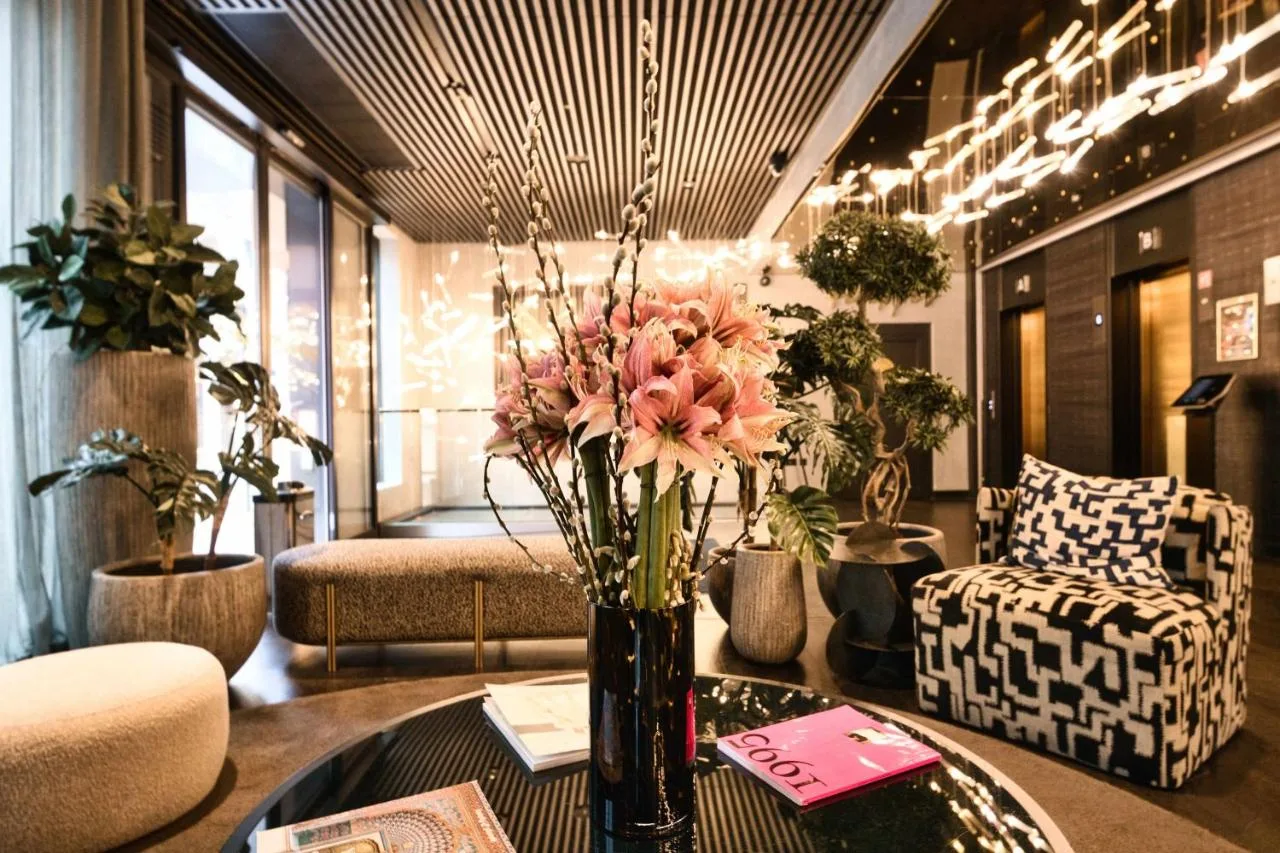 Hotel lobby with a vase of flowers at AMANO Covent Garden, near Russell Street